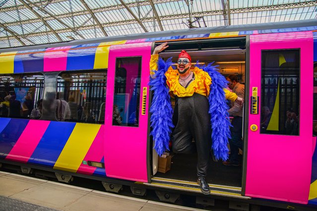 Two trains carrying 170 Eurovision song contest superfans are welcomed by drummers, drag queens, and dance troops as they arrive into Liverpool Lime Street train station on Tuesday, May 9, 2023. (Photo by Peter Byrne/PA Images via Getty Images)