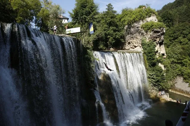 A competitor dives during the international waterfall jumping competition in the old town of Jajce, 250 kms west of Sarajevo, Bosnia, on Saturday, August 1, 2015. (Photo by Amel Emric/AP Photo)