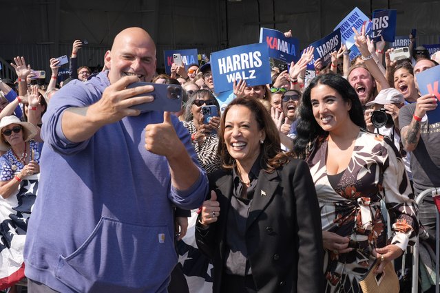 Democratic presidential nominee Vice President Kamala Harris takes a selfie with Sen. John Letterman, D-Pa., and his wife Gisele Barreto Fetterman, after Harris arrived at John Murtha Johnstown-Cambria Airport, in Johnstown, Pa., for a campaign event, Friday, September 13, 2024. (Photo by Jacquelyn Martin/AP Photo)