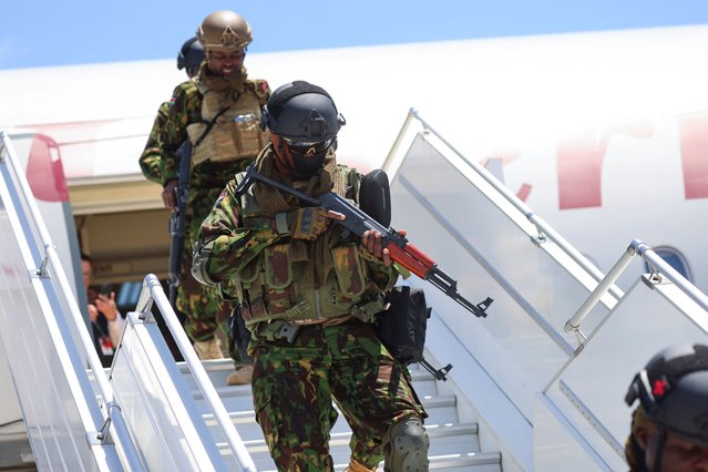 Members of the second contingent of Kenyan police disembark after arriving in the Caribbean country as part of a peacekeeping mission, in Port-au-Prince, Haiti on July 16, 2024. (Photo by Ralph Tedy Erol/Reuters)