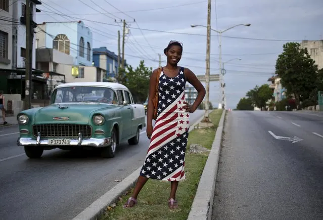 Yavida, 17, poses while wearing a dress with the colors of the U.S. flag on a street in Havana August 4, 2015. (Photo by Enrique De La Osa/Reuters)