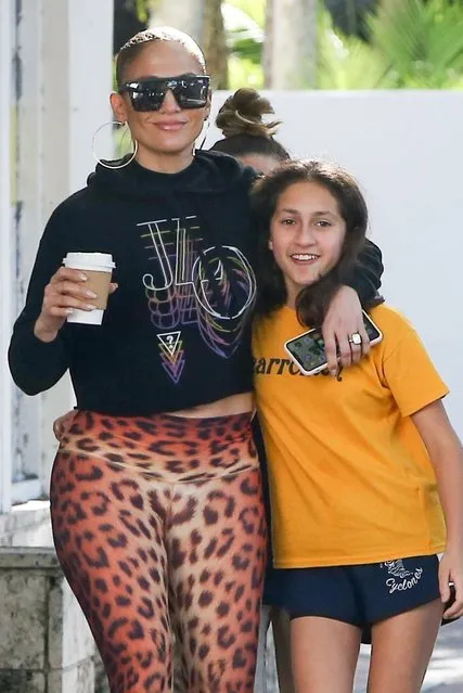 Jennifer Lopez looks fit and happy stopping at a bakery with her daughter Emme after leaving the gym in preparation for her Super Bowl show in Miami, FL on January 20, 2020. Jennifer stands out in sunglasses, a JLO hoodie, leopard print leggings, and black sneakers. (Photo by Backgrid USA)