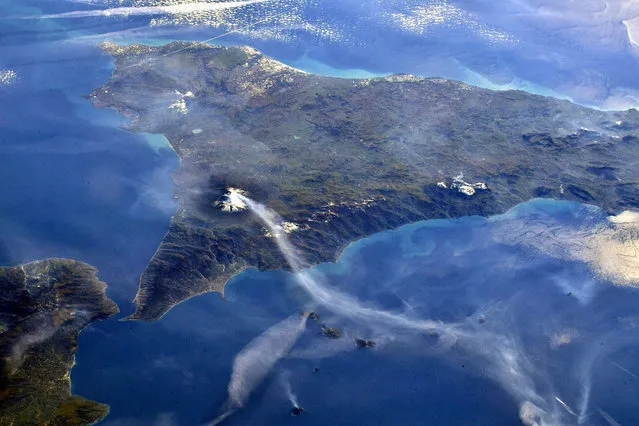 Image taken from the International Space Station by European Space Agency German astronaut shows smoke after powerful eruption of Mount Etna in eastern Sicily on February 11, 2022. (Photo by EyePress News/Rex Features/Shutterstock)