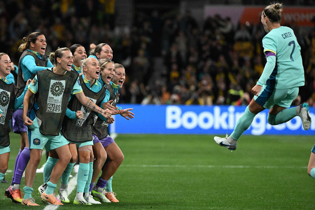 Australia's defender #07 Stephanie Catley (R) celebrates with teammates after scoring her team's fourth goal from the penalty kick during the Australia and New Zealand 2023 Women's World Cup Group B football match between Canada and Australia at Melbourne Rectangular Stadium, also known as AAMI Park, in Melbourne on July 31, 2023. (Photo by William West/AFP Photo)