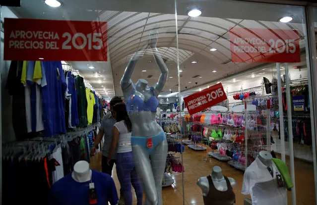 A store with signs read: “take advantage of 2015 prices” is seen at a shopping mall in Caracas, Venezuela, June 23, 2016. (Photo by Mariana Bazo/Reuters)