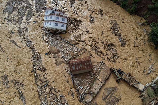 An aerial view shows the area affected by monsoon flooding in Roshi village of Nepal's Kavre district on September 30, 2024. Search and rescue teams in Nepal's capital picked through wrecked homes on September 30 after waters receded from monsoon floods that killed at least 209 people around the Himalayan republic. (Photo by Prabin Ranabhat/AFP Photo)