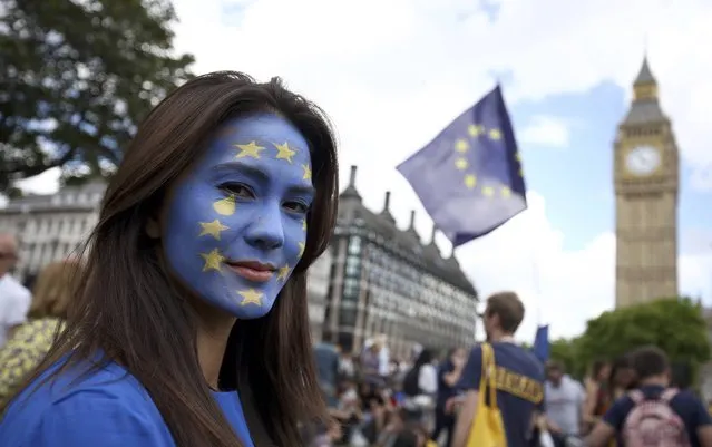 A woman with a painted face poses for a photograph during a 'March for Europe' demonstration against Britain's decision to leave the European Union, in central London, Britain July 2, 2016. Britain voted to leave the European Union in the EU Brexit referendum. (Photo by Neil Hall/Reuters)