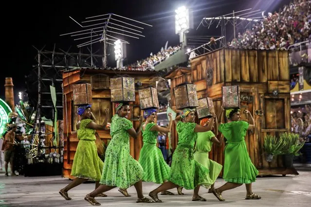 Members of Mocidade samba school perform during the second night of the Carnival parade at the Sambadrome in Rio de Janeiro, Brazil on February 25, 2020. (Photo by Ricardo Moraes/Reuters)