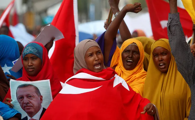 Somali women carry Turkish flags as they chant slogans in support of Turkish President Tayyip Erdogan and his government in Somalia's capital Mogadishu, July 16, 2016. (Photo by Feisal Omar/Reuters)