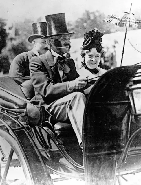 American inventor, industrialist and motor car pioneer Henry Ford (1863–1947) driving an 1860 Pageant motor car whilst his wife Clara sits beside him.