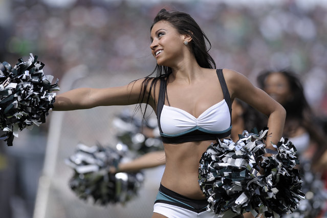 A Philadelphia Eagles cheerleader performs during the first half of an NFL football game against the San Diego Chargers, Sunday, Sept. 15, 2013, in Philadelphia. (Photo by Michael Perez/AP Photo)