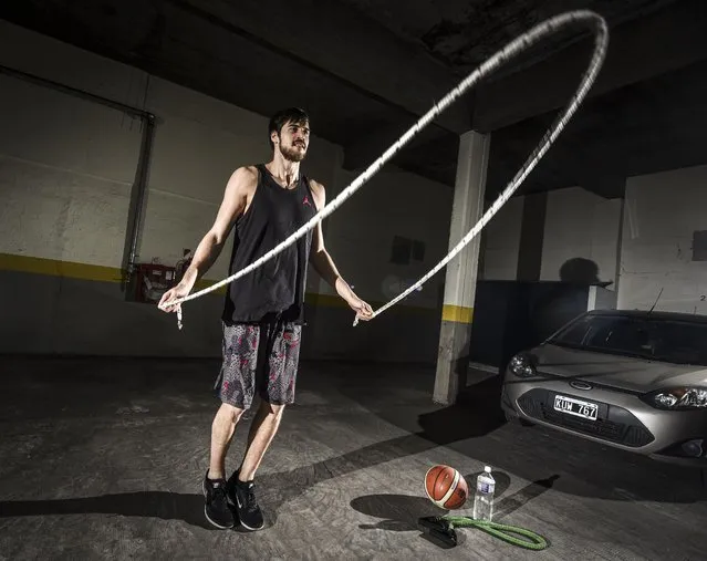 2,05m tall (6.7 feet) Argentine basketball player Kevin Hernandez trains in isolation in the garage of his building during coronavirus pandemic on May 09, 2020 in Buenos Aires, Argentina. (Photo by Marcelo Endelli/Getty Images)