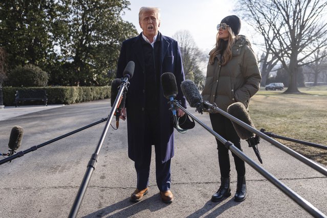 First lady Melania Trump looks on as President Donald Trump speaks with reporters before boarding Marine One on the South Lawn of the White House, Friday, January 24, 2025, in Washington. (Photo by Evan Vucci/AP Photo)