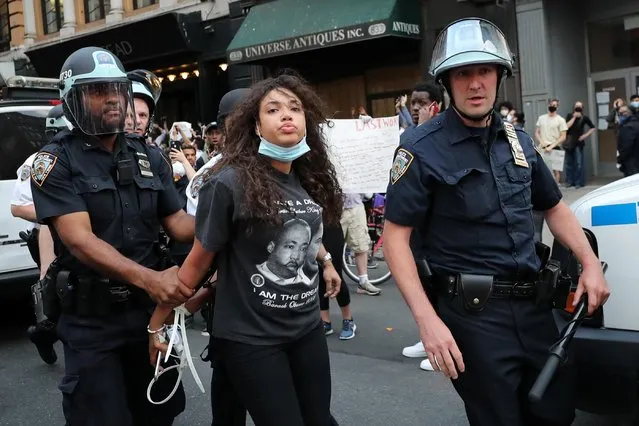 Police officers detain a demonstrator during a protest against the death in Minneapolis police custody of George Floyd, in the Manhattan borough of New York City, U.S., June 2, 2020. (Photo by Jeenah Moon/Reuters)