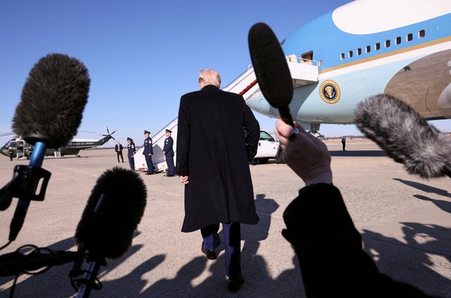 President Donald Trump turns to board Air Force One after speaking to reporters upon departure from Joint Base Andrews in Maryland, on February 14, 2025. (Photo by Kevin Lamarque/Reuters)