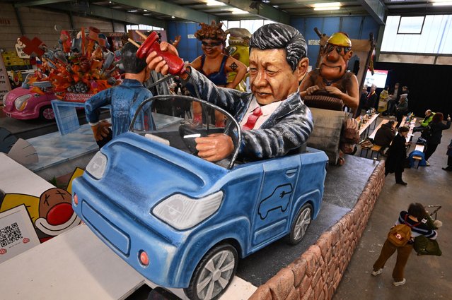 A carnival float depicting Chinese President Xi Jinping sitting in an e-car is pictured ahead a press conference on the shrove monday procession of the carnival season in Mainz, on February 6, 2024. (Photo by Kirill Kudryavtsev/AFP Photo)