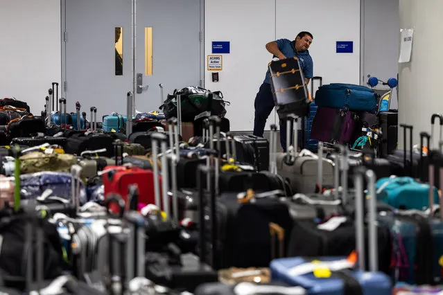 Unclaimed luggage piles up in a baggage claim area at Los Angeles International Airport as flight cancellations and delays mount following a deadly winter storm on December 28, 2022 in Los Angeles, California. (Photo by Qian Weizhong/VCG via Getty Images)