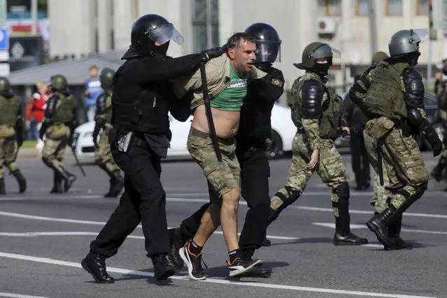 Riot police officers detain a protester during a Belarusian opposition supporters' rally protesting the official presidential election results in Minsk, Belarus, Sunday, September 13, 2020. (Photo by AP Photo/Stringer)