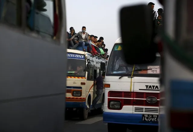 Passengers ride an overcrowded bus as they head towards their village to celebrate "Dashain", the biggest religious festival for Hindus in Nepal, as fuel crisis continues in Kathmandu, October 20, 2015. (Photo by Navesh Chitrakar/Reuters)