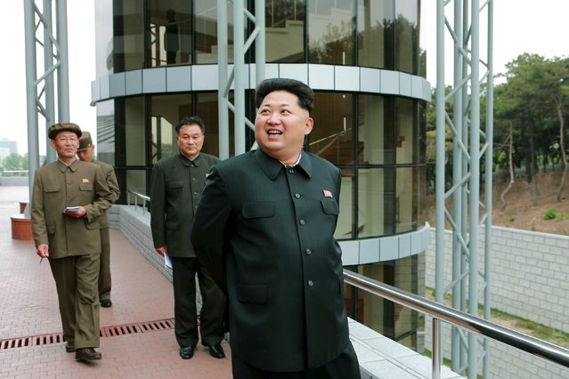 North Korean leader Kim Jong Un (R) provides field guidance at the newly built National Space Development General Satellite Control and Command Centre in this undated photo released by North Korea's Korean Central News Agency (KCNA) in Pyongyang May 3, 2015. (Photo by Reuters/KCNA)