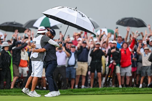 J.J. Spaun celebrates with his caddie, Mark Carens, after sinking a long putt to win the US Open in Oakmont, Pennsylvania, on Sunday, June 15, 2025. It is the first major title of his career. (Photo by Patrick Smith/Getty Images)