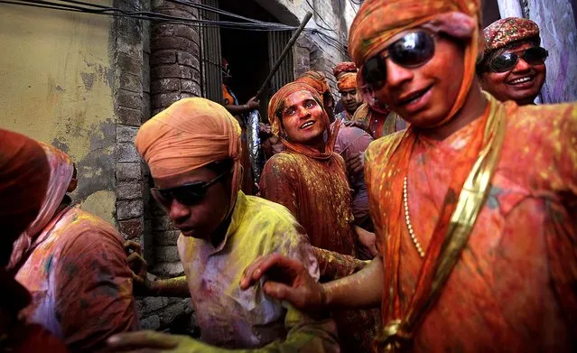 Villagers from Nandgaon arrive in Barsana, on March 22, 2013. (Photo by Manish Swarup/Associated Press)