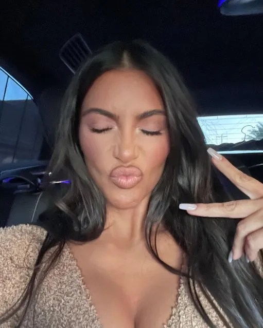 American socialite and media personality Kim Kardashian throws a peace sign up to her followers in the second decade of February 2023. (Photo by kimkardashian/Instagram)