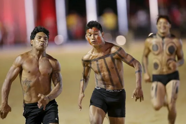 Indigenous men from several tribes compete in the 100 metres race during the first World Games for Indigenous Peoples in Palmas, Brazil, October 28, 2015. (Photo by Ueslei Marcelino/Reuters)