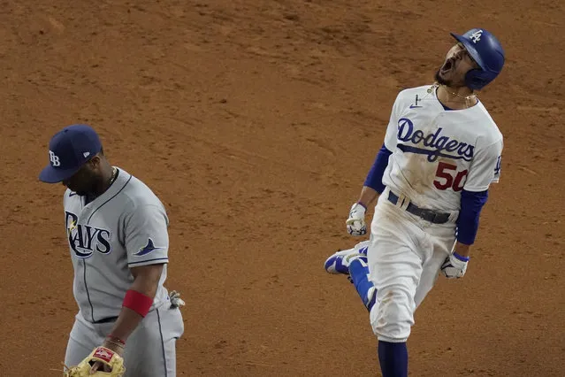 Los Angeles Dodgers' Mookie Betts celebrates after a home run against the Tampa Bay Rays during the eighth inning in Game 6 of the baseball World Series Tuesday, October 27, 2020, in Arlington, Texas. (Photo by Sue Ogrocki/AP Photo)