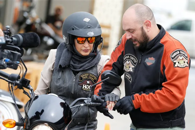 Maryam Ahmed Al-Moalem, a Saudi female bike rider, is given basics of operating a bike by Rebal Mohammed trainer, during her lessons in advanced motorbike training at Harley Davidson training centre in Manama, Bahrain, March 16, 2018. (Photo by Hamad I. Mohammed/Reuters)