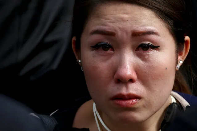 A mourner cries as she pays her respects to Thailand's late King Bhumibol Adulyadej in front of the Grand Palace in Bangkok, Thailand, October 15, 2016. (Photo by Athit Perawongmetha/Reuters)