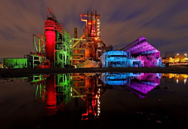 The former Phoenix West blast furnace is colorfully illuminated in Dortmund, Germany, 24 October, 2020. The light artist Thorsten Pfister “lichtkunst.ruhr” illuminates different historical industrial buildings in the Ruhr area in a variety of colors. The different colors are a symbol for the diversity of the population of the Ruhr area. (Photo by Friedemann Vogel/EPA/EFE)