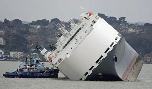 The stricken vessel “Hoegh Osaka” lies trapped on her side on the Brambles Sand Bank between Calshot Bay and Cowes on The Isle of Wight, Britain, 05 January 2015. (Photo by Gerry Penny/EPA)