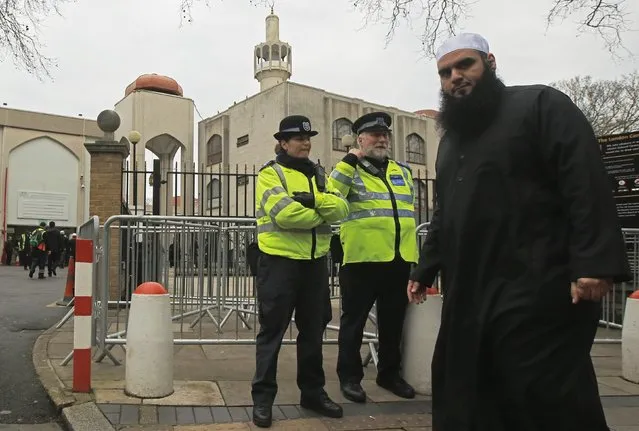 Police and community support officers carry out a regular patrol as worshippers arrive at the London Central Mosque at Regent's Park in London January 9, 2015. (Photo by Luke MacGregor/Reuters)