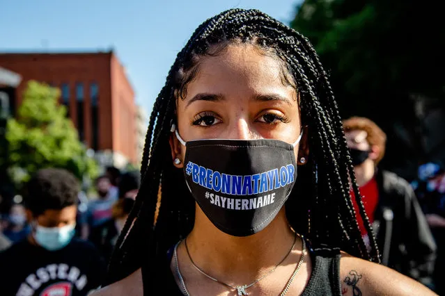 A protestor wears a mask honouring Breonna Taylor at a demonstration in downtown Louisville, US on June 1, 2020 in solidarity with Minneapolis following the killing of George Floyd. (Photo by Amy Harris/Rex Features/Shutterstock)