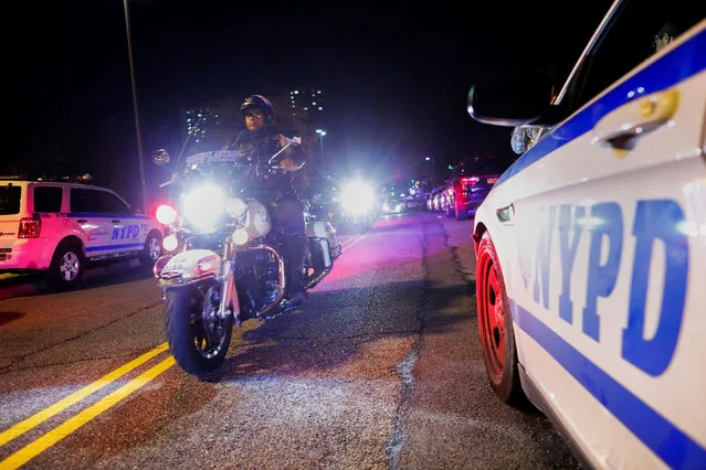 New York Police officers take part in a procession carrying the body of Sergeant Paul Tuozzolo, who was fatally shot in a shootout, at the Jacobi Medical Center in the neighborhood of Bronx in New York, U.S. November 4, 2016. (Photo by Eduardo Munoz/Reuters)