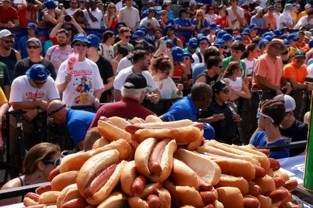 People gather for the 2023 Nathan's Famous Fourth of July International Hot Dog Eating Contest at Coney Island in New York City, U.S., July 4, 2023. (Photo by Amr Alfiky/Reuters)
