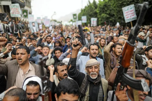 Men hold firearms as people demonstrate against the desecration of the Koran in Denmark, in Sanaa, Yemen on July 24, 2023. (Photo by Khaled Abdullah/Reuters)