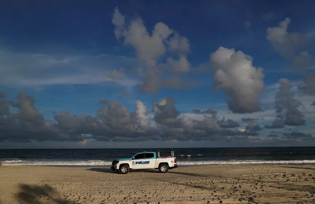 A police vehicle patrols the beach ahead of the arrival of Hurricane Florence in Myrtle Beach, South Carolina, U.S. September 11, 2018. (Photo by Randall Hill/Reuters)