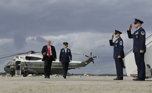 President Donald Trump boards Air Force One for a campaign rally in Erie, Pa., Wednesday, October 10, 2018, in Andrews Air Force Base, Md. (Photo by Evan Vucci/AP Photo)