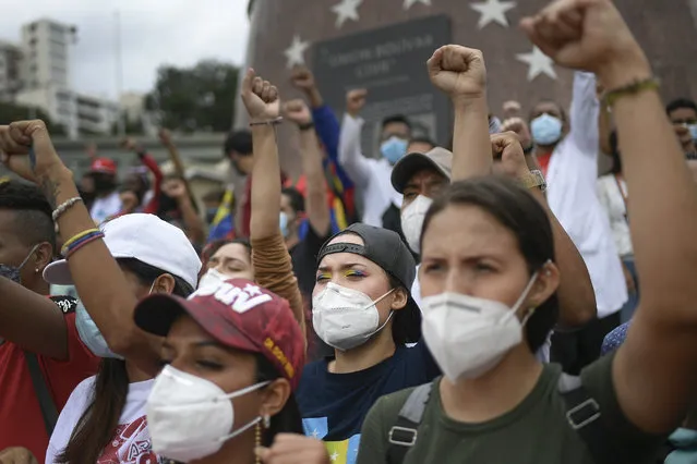Venezuelan government supporters gather on Bolivar Avenue in Caracas, Venezuela, Saturday, May 8, 2021, during a gathering to show solidarity with the protesters in Colombia who were against a proposed tax plan, since withdrawn by the president. (Photo by Matias Delacroix/AP Photo)