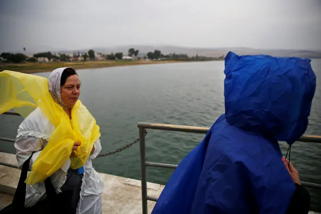 Christian tourists stand on a dock before boarding a boat as they tour the Sea of Galilee near Tiberias, Israel November 30, 2016. (Photo by Ronen Zvulun/Reuters)