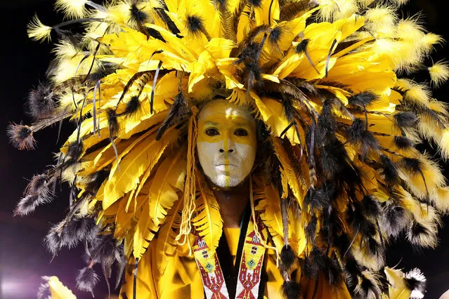 A picture made available on 04 February 2016 shows Fareed Raffick, portraying a North American Indian warrior, performing before the judges at the Traditional Mas Competition held during the annual Carnival celebrations, at Adam Smith Square, in the capital of Port-of-Spain, Trinidad and Tobago, 03 February 2016. (Photo by Andrea De Silva/EPA)
