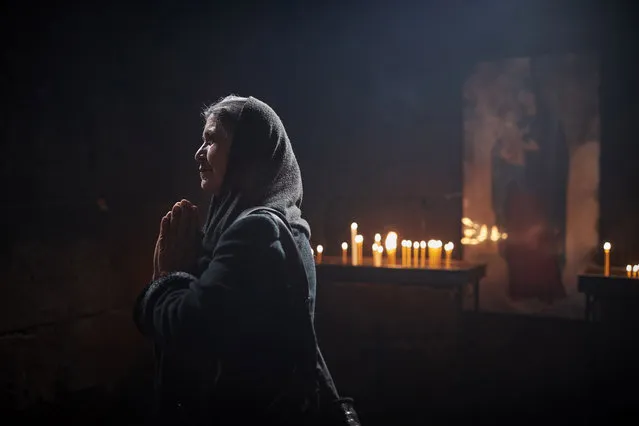 A worshipper prays at St Hripsime Church, one of the oldest churches in Armenia, in Etchmiadzin, the spiritual capital of Armenia, to mark Holy Thursday on April 01, 2021 in Etchmiadzin, Armenia. Holy Thursday or Maundy Thursday is the Christian holy day commemorating the washing of the feet and Last Super of Jesus Christ with the Apostles on the Thursday before Easter. Armenia is regarded as the oldest Christian state, with the historical Kingdom of Armenia having declared Christianity as its official religion by 301 AD. (Photo by Kiran Ridley/Getty Images)