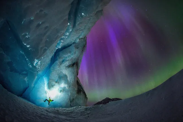 A pair of ice climbers have been snapped in front of a stunning aurora. Mike Stuart and Takeshi Tani were climbing the Athabasca Glacier in Alberta, Canada, when the aurora lit up the nights sky. They were photographed by famed night-time photographer Paul Zizka, who specialises in photographing auroras in some of Canadas most beautiful parks. (Photo by Paul Zizka/Caters News)