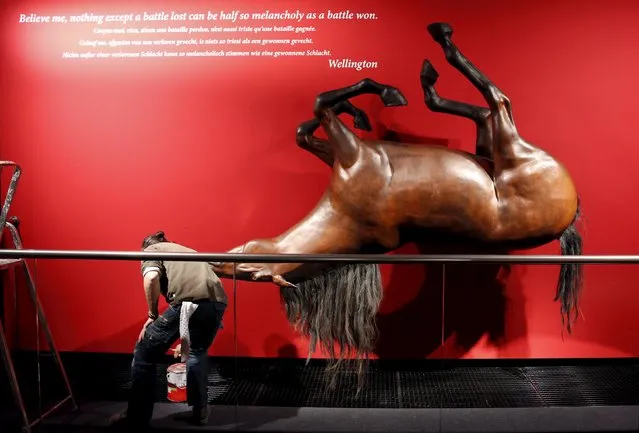 A worker is seen near a replica of horse at the museum “Memorial 1815” in Braine-l'Alleud April 21, 2015, part of the commemorations of the Bicentenary of the Battle of Waterloo in Belgium on June 19 and 20. (Photo by Francois Lenoir/Reuters)