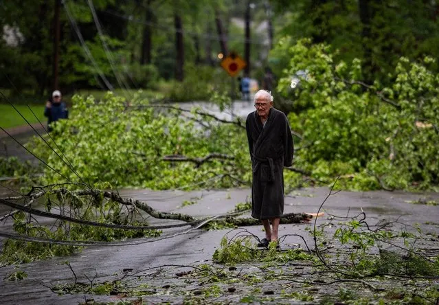 Bill Johnson looks at the downed trees and power lines from the storm the night before on Northampton Drive in Jackson, Miss on April 10, 2024. “Sounded like a freight train going over”, Johnson said. (Photo by Lauren Witte/Clarion Ledger via USA TODAY Network)