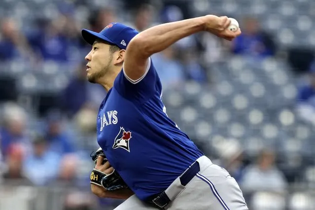 Toronto Blue Jays starting pitcher Yusei Kikuchi throws during the first inning of a baseball game against the Kansas City Royals Monday, April 22, 2024, in Kansas City, Mo. (Photo by Charlie Riedel/AP Photo)