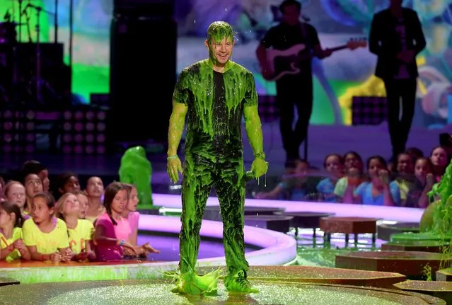 Mark Wahlberg gets slimed at the 27th annual Kids' Choice Awards at the Galen Center on Saturday, March 29, 2014, in Los Angeles. (Photo by Matt Sayles/Invision/AP Photo)