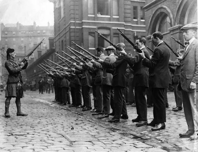 1914: Members of the London Scottish Regiment undertake rifle drill. The London Scottish Regiment was formed by Lord Elcho, 10th Earl of Wemyss, in 1859 as the London Scottish Rifle Volunteers. They are affiliated to the Gordon Highlanders and wear the Elcho tartan (Hodden Grey)